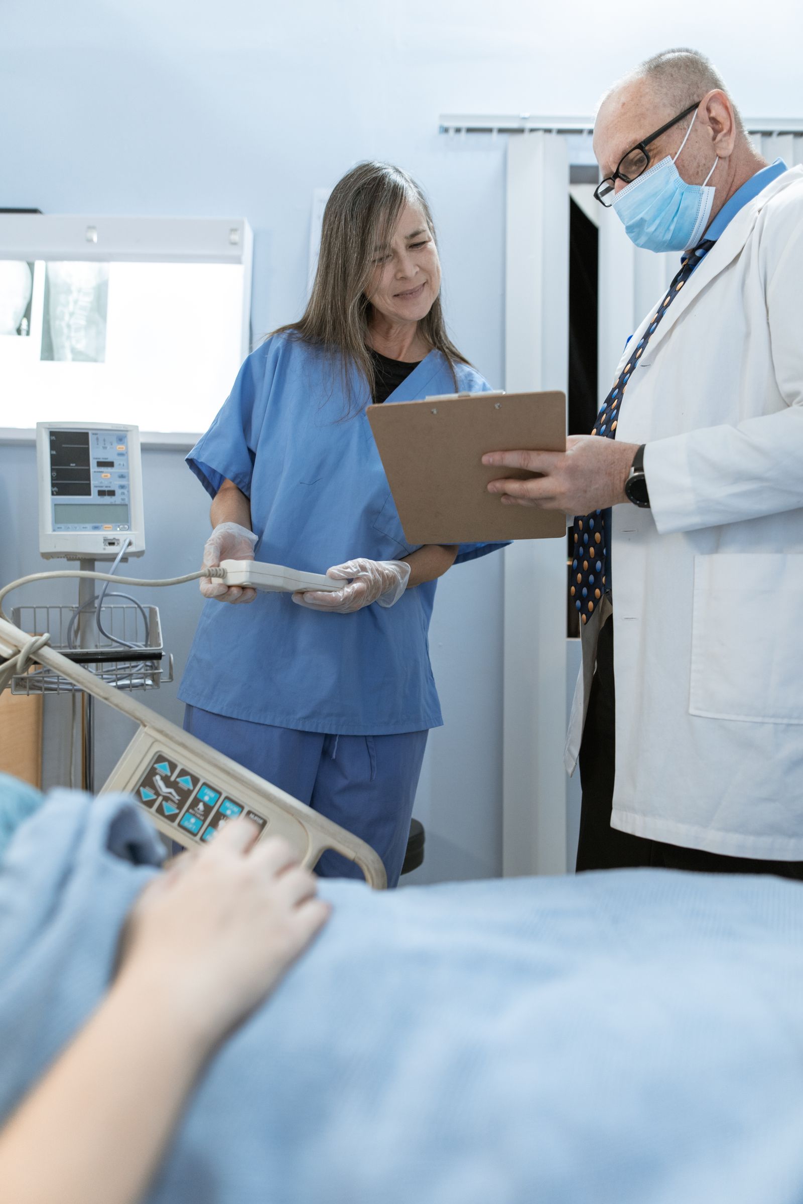 A clinician and colleague discussing patient care